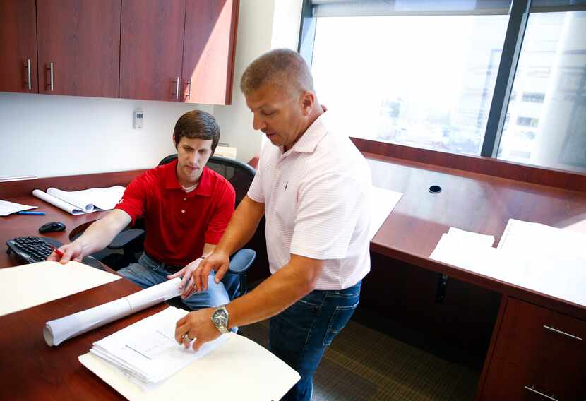 Mark Shannon (left) and Mike Thames discuss a project at K2 Construction.