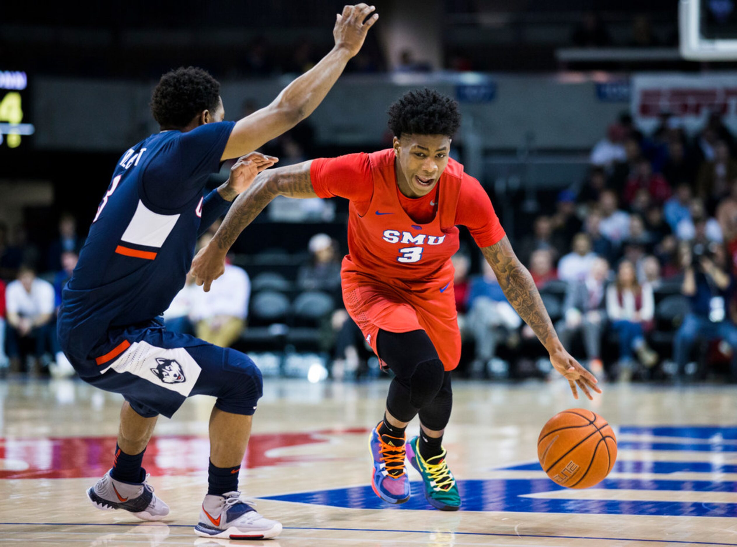 Southern Methodist Mustangs guard Kendric Davis (3) gets around Connecticut Huskies guard...