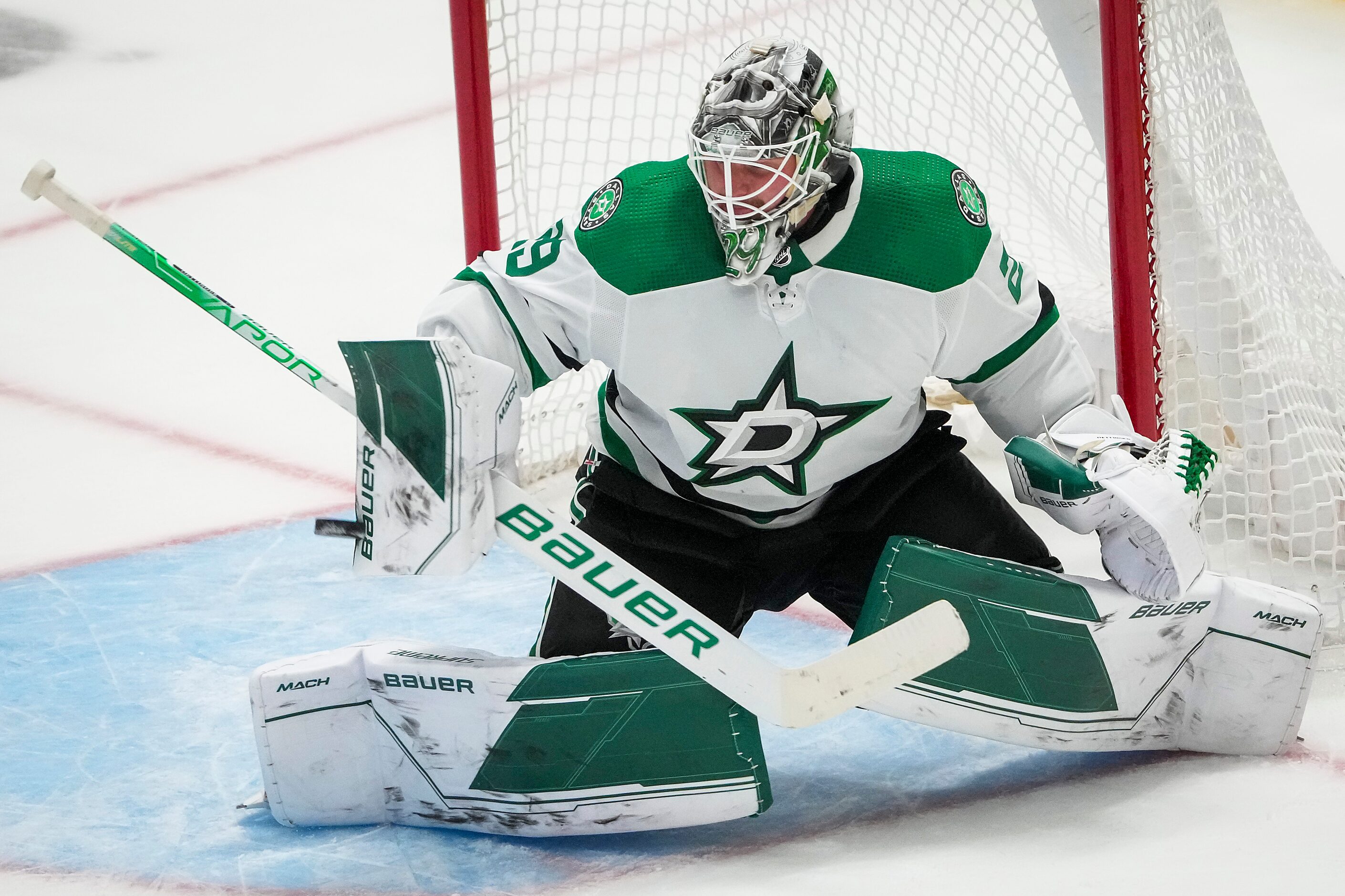 Dallas Stars goaltender Jake Oettinger (29) makes a save during the third period of an NHL...