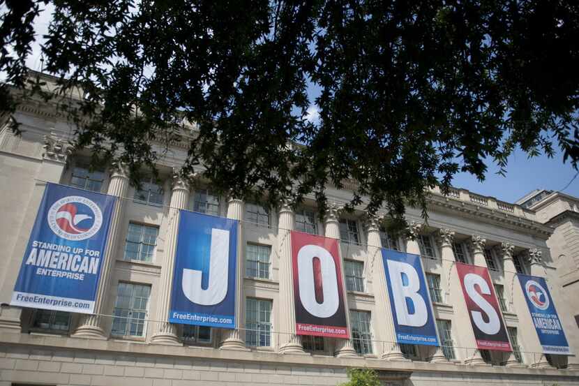 A Jobs sign is seen on the US Chamber of Commerce Building in Washington, DC, on August 2,...