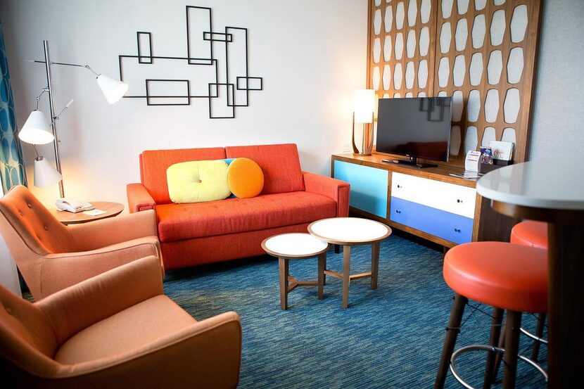 Colorful 1950s-themed  furniture fills the interior of a courtyard family suite poolside...