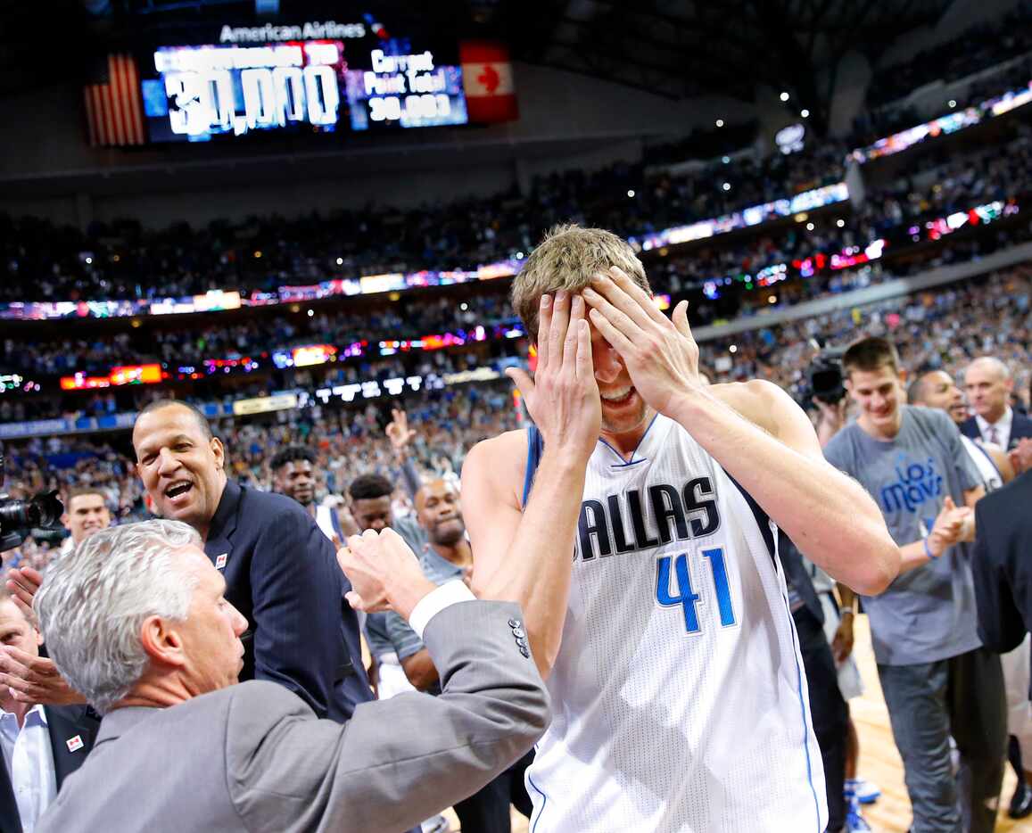 Dirk Nowitzki (41) was the center of attention after he surpassed the 30,000-point mark for...