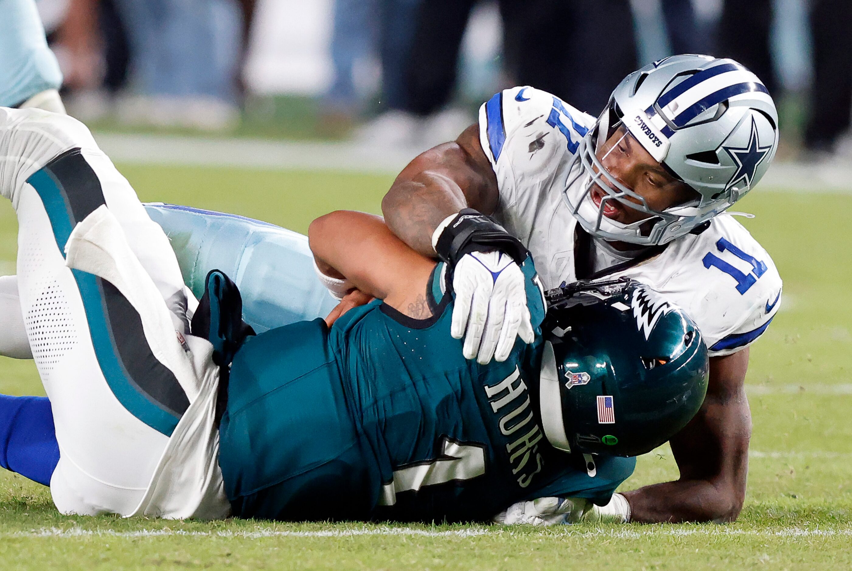 Dallas Cowboys linebacker Micah Parsons (11) sacks Philadelphia Eagles quarterback Jalen...