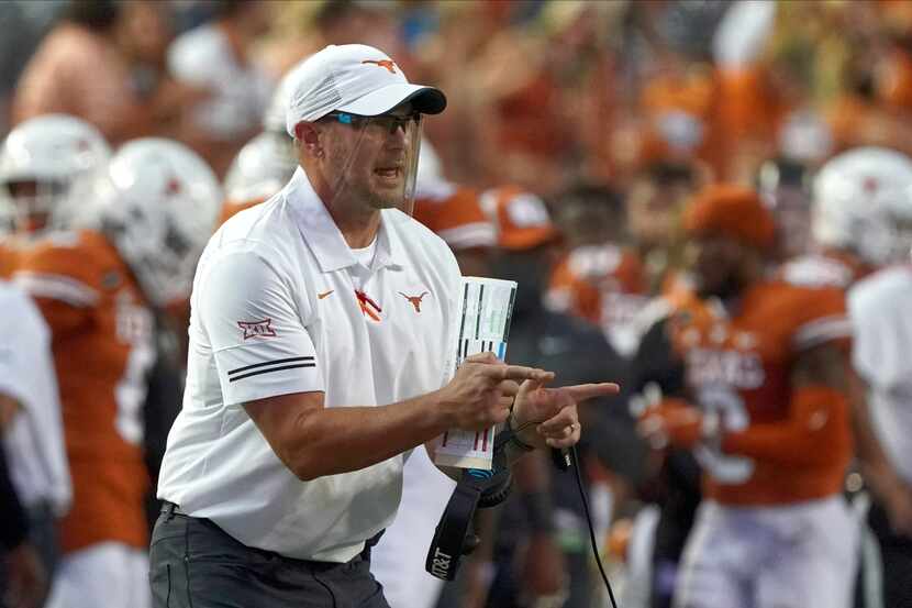 FILE - In this Sept. 12, 2020, file photo, Texas head coach Tom Herman shouts to his team...