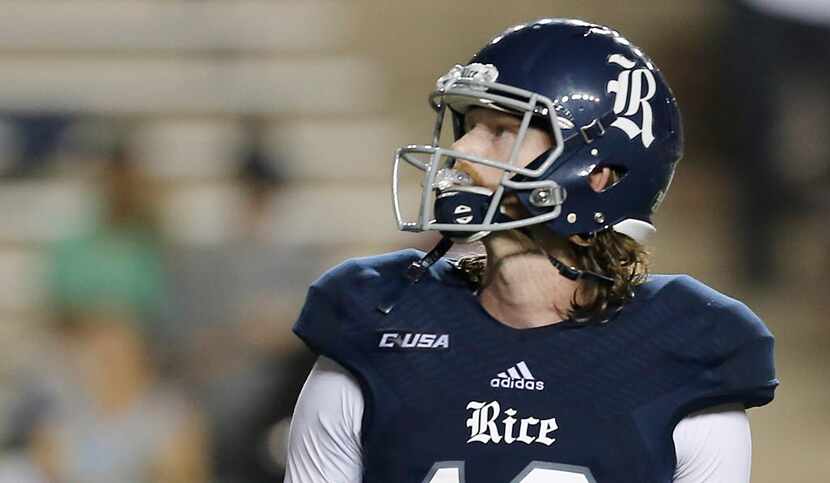 HOUSTON, TX - SEPTEMBER 24: Quarterback Tyler Stehling #10 of the Rice Owls looks at the...