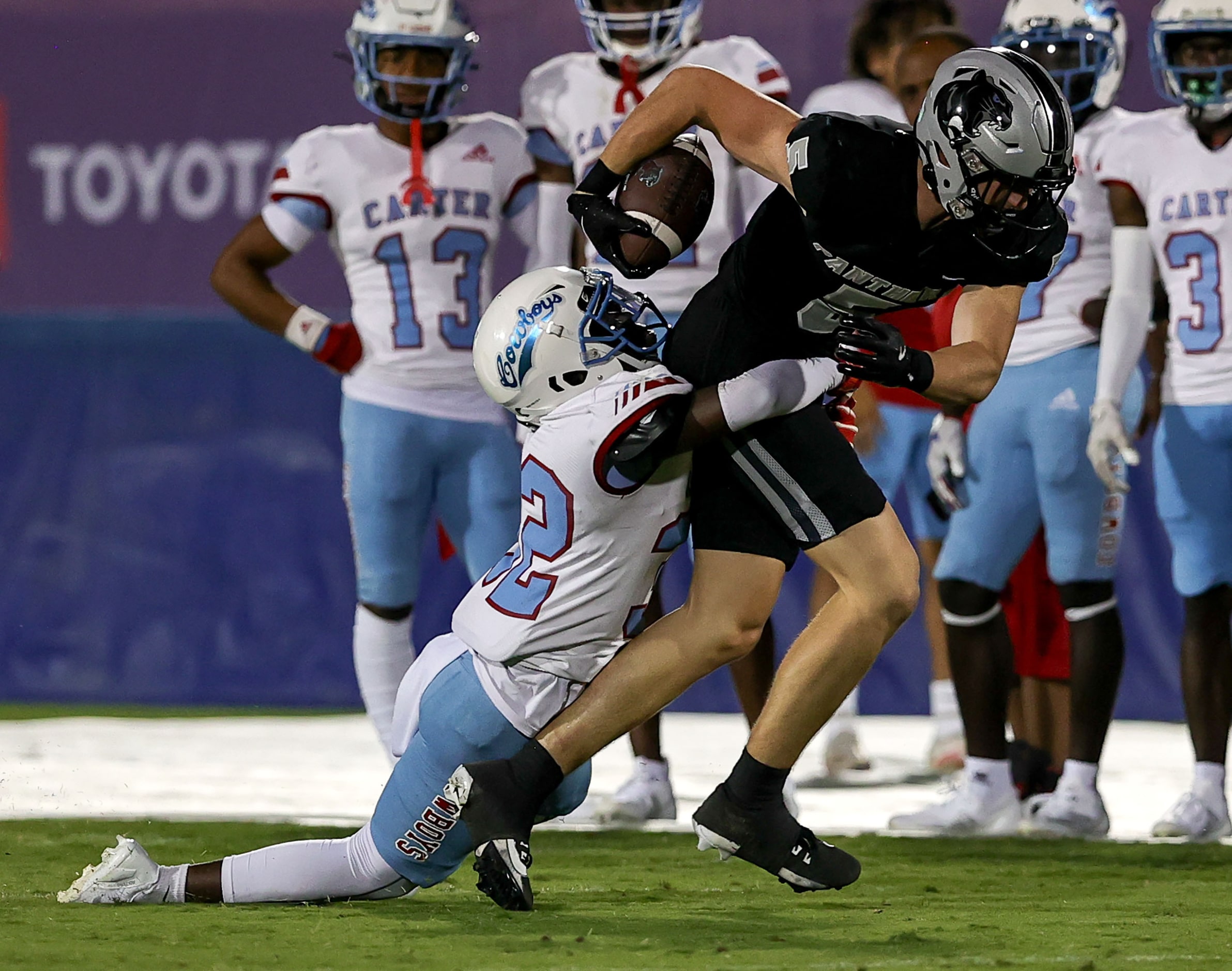 Frisco Panther Creek wide receiver Parker Ord (5) drags Dallas Carter defensive back Zion...