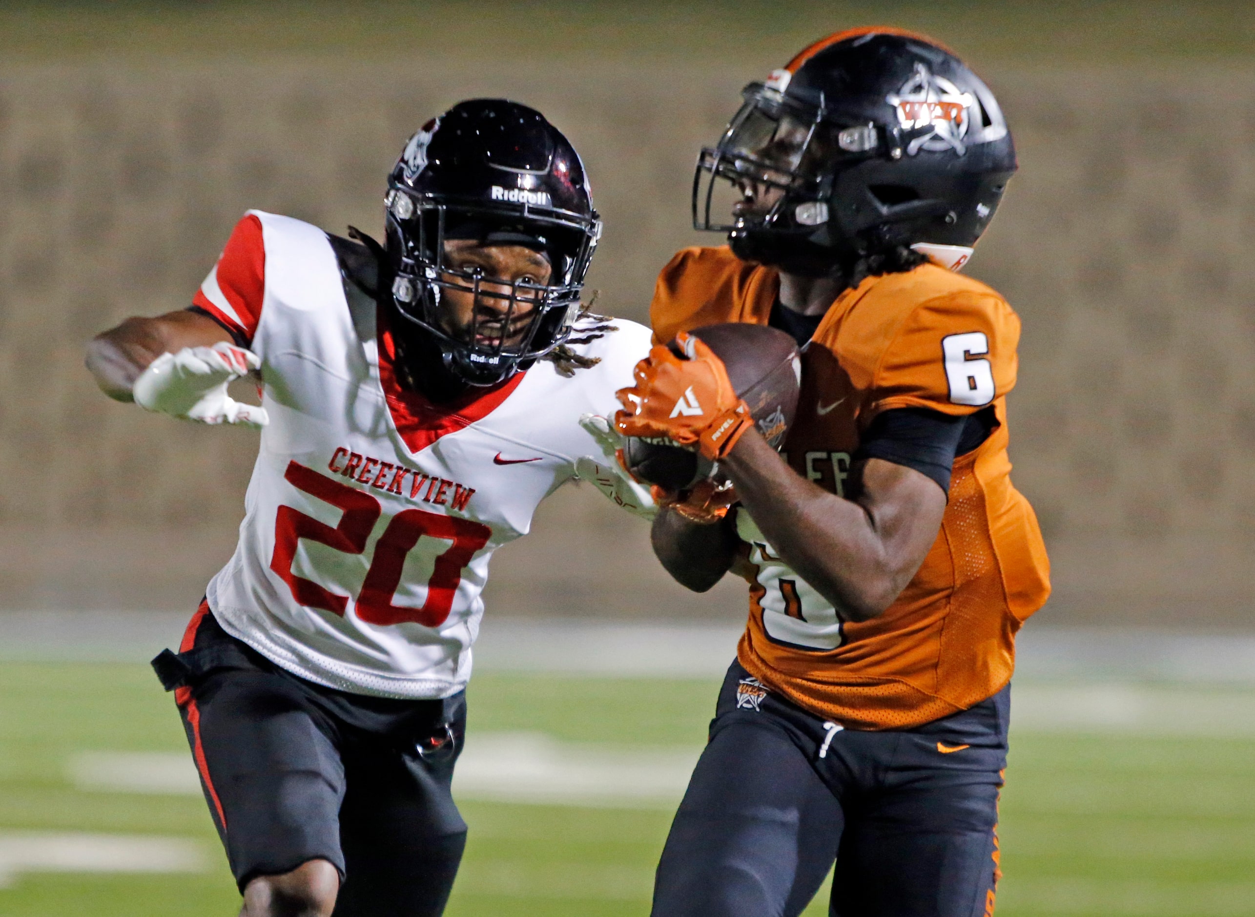 West Mesquite High WR Richard Clark (6) grabs a pass for a long gain over late arriving...