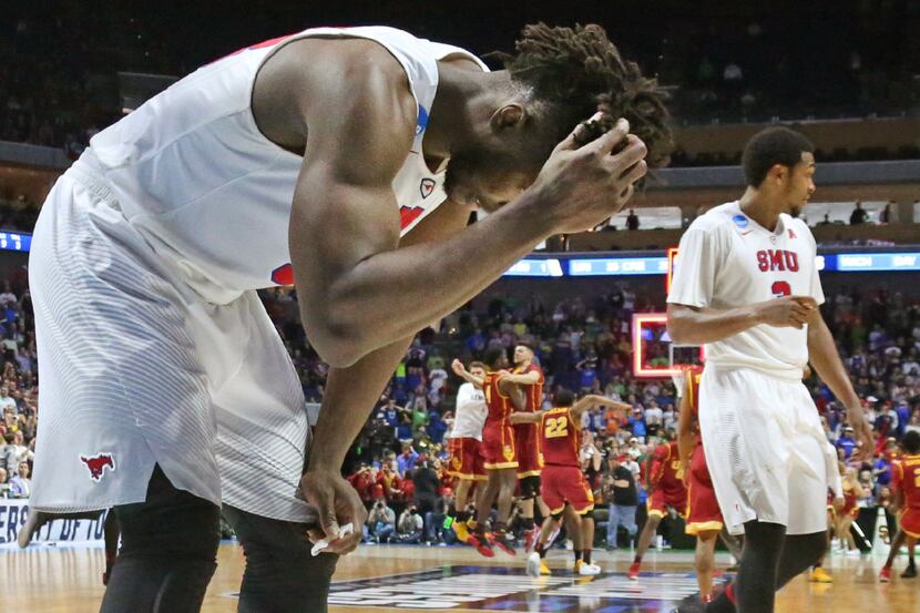 SMU forward Semi Ojeleye (33) holds his head in disbelief as time runs out as the Trojans...