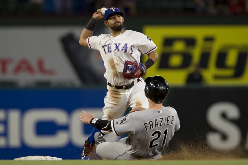 May 9, 2016; Arlington, TX, USA; Texas Rangers second baseman Rougned Odor (12) tags out...