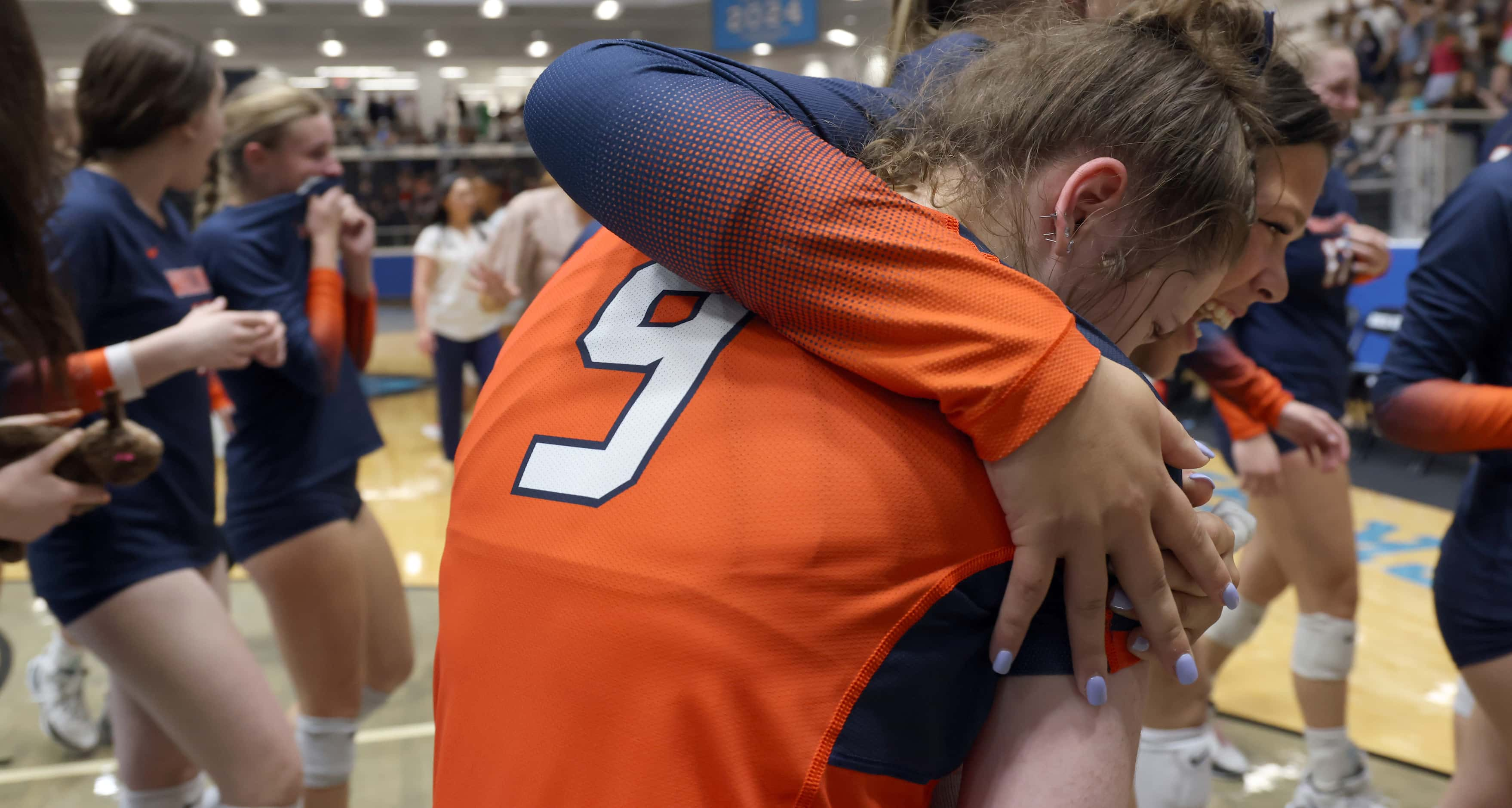 Frisco Wakeland players Aubrey Fernandez (9), foreground, and Deni McCalmont (12) share a...