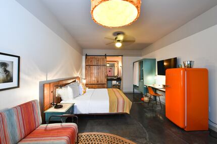 Every room at Texican Court, a new hotel in Las Colinas, has an orange Smeg fridge.