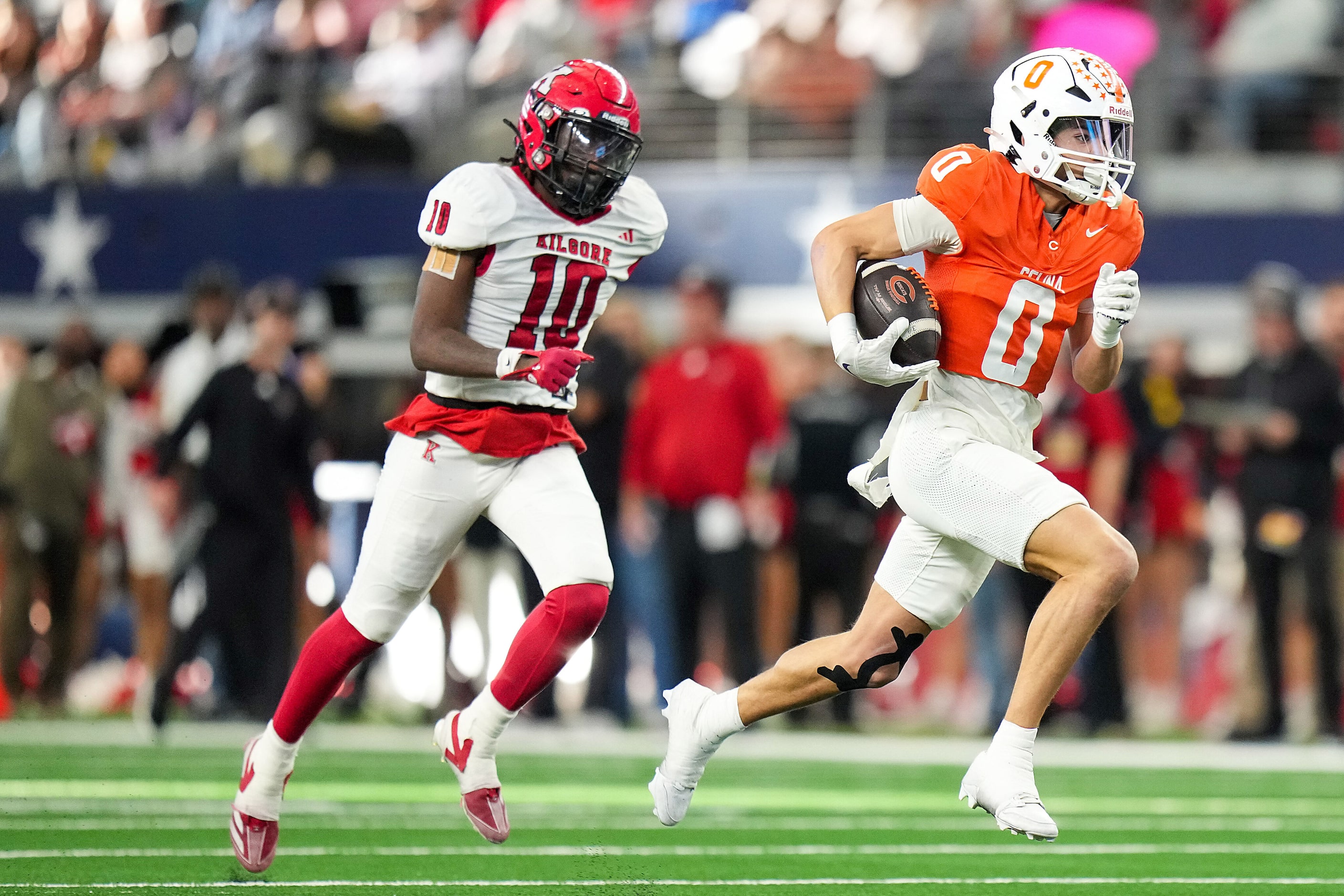 Celina's Ethan Rucker (0) scores on a 61-yard touchdown reception past Kilgore's Jamarian...