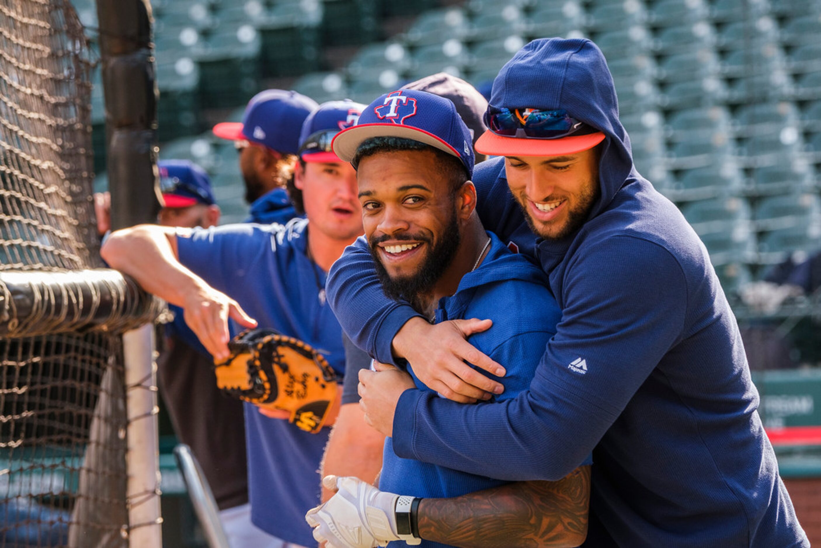 Texas Rangers outfielder Delino DeShields gets a hug from Houston Astros outfielder George...