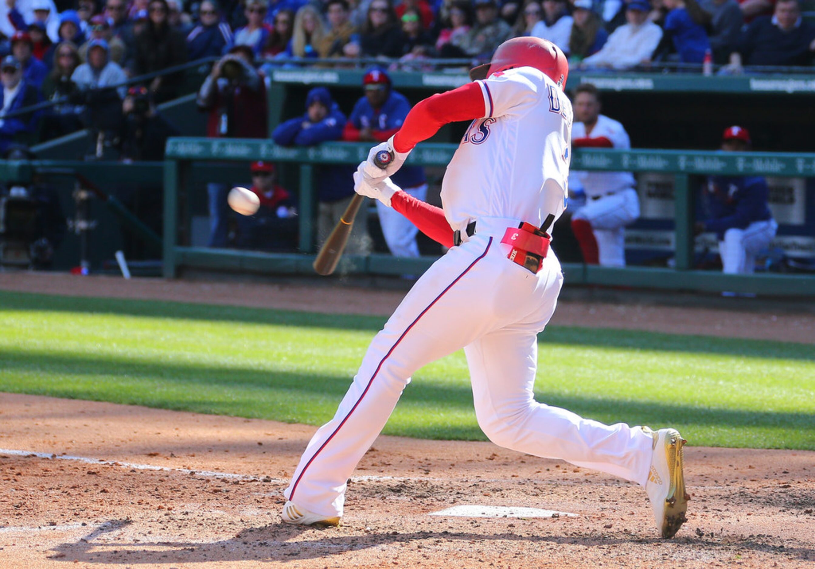 ARLINGTON, TX - MARCH 31: Delino DeShields #3 of the Texas Rangers hits a grand slam in the...