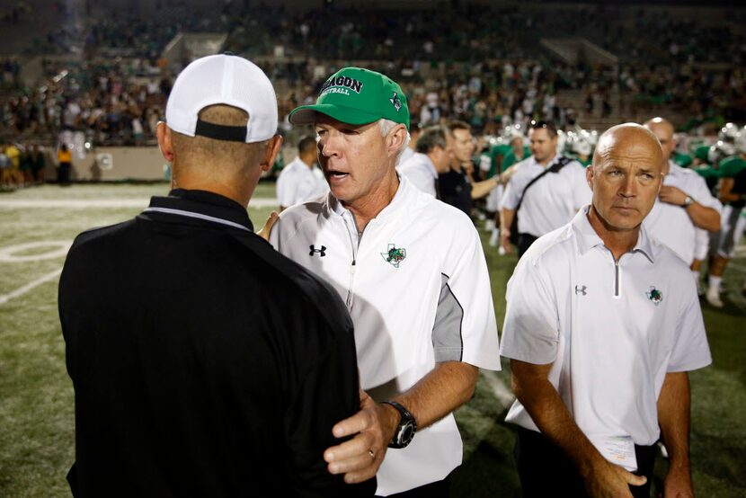 Southlake Carroll head coach Hal Wasson greets Abilene  head coach Steve Warren after...