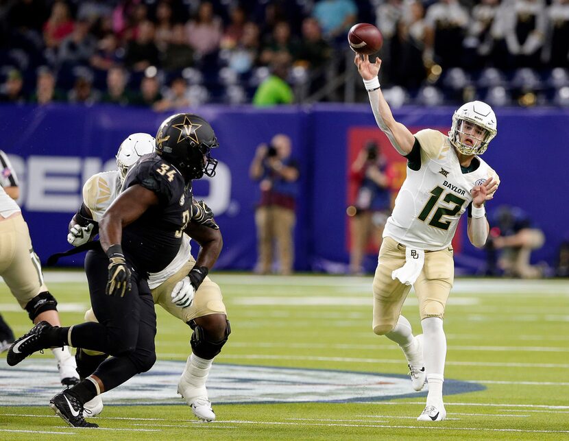 Baylor quarterback Charlie Brewer (12) passes the ball as Vanderbilt defensive lineman Dare...