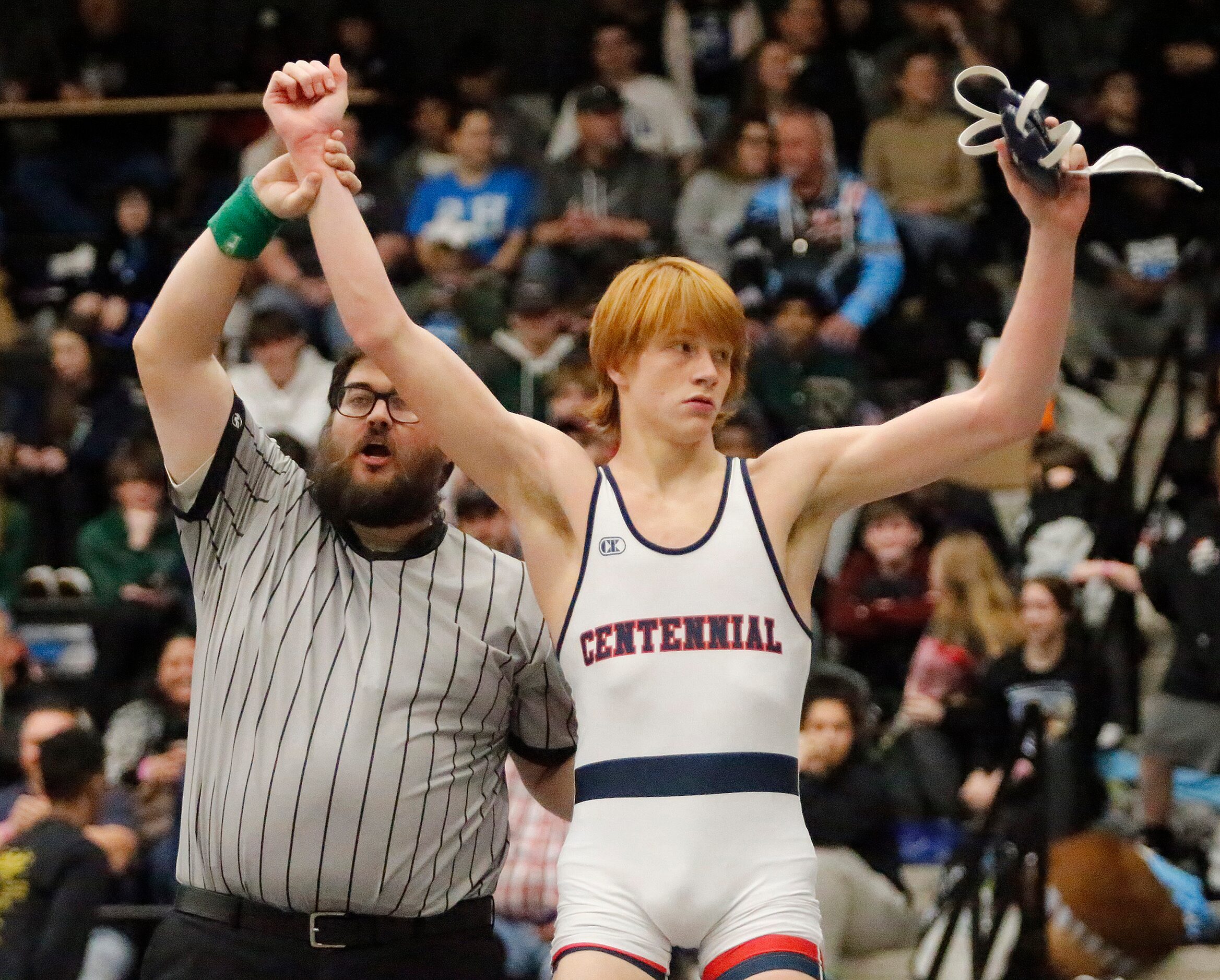 Tyten Volk of Frisco Centennial High School is declared the winner of his 152 division match...