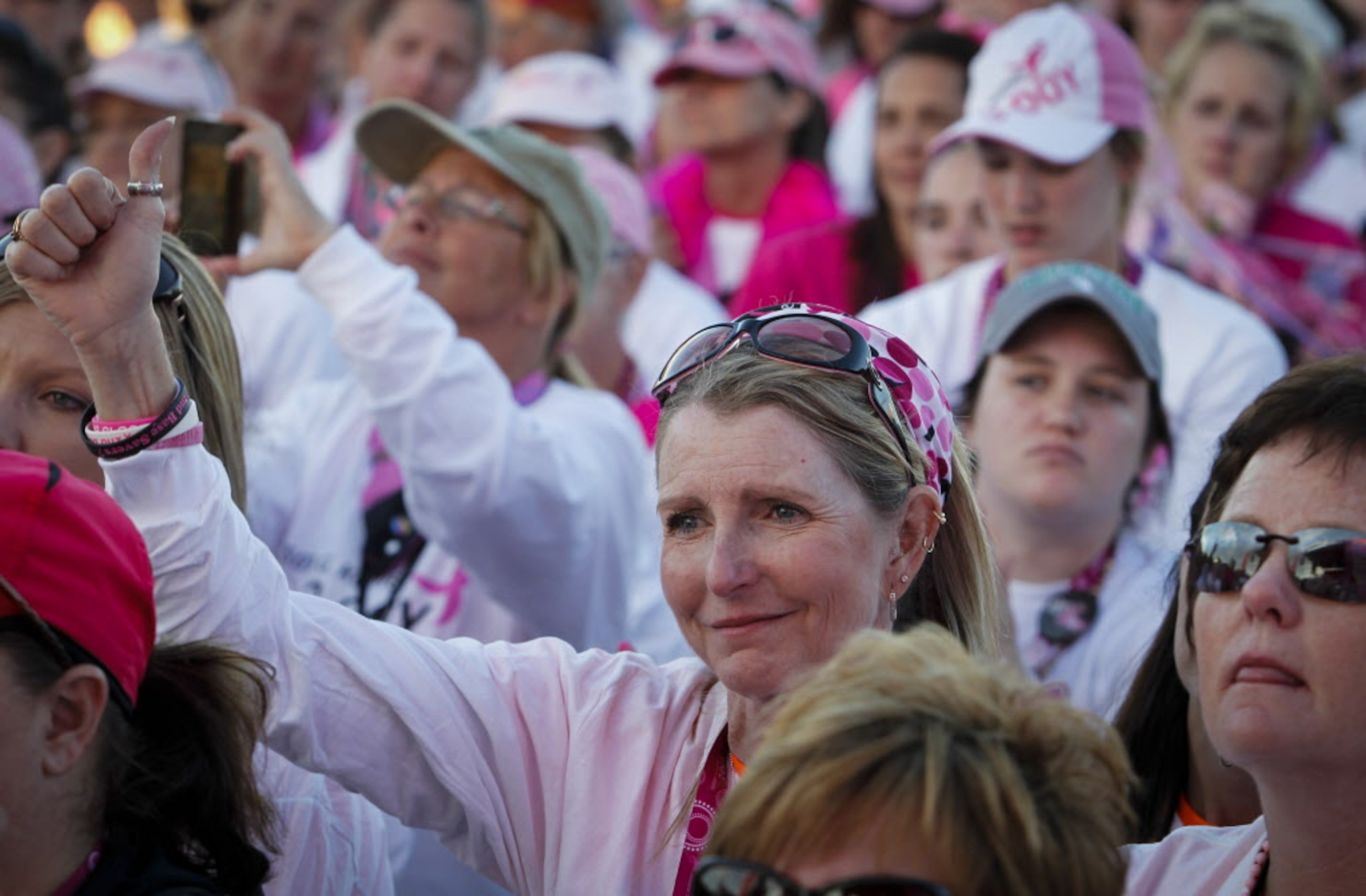 Walkers look on during the closing ceremony of the 2014 Susan G. Komen Dallas/Fort Worth...