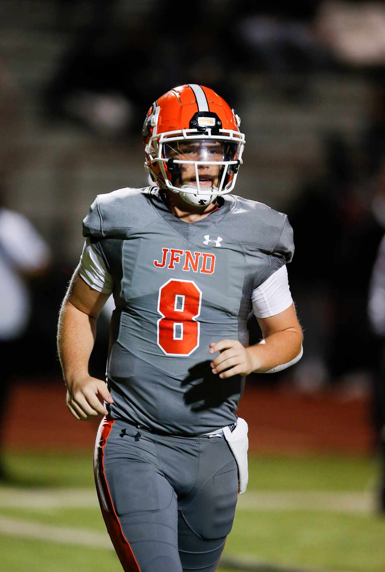 Rockwall senior quarterback Braedyn Locke jogs off the field after throwing a pass for a...