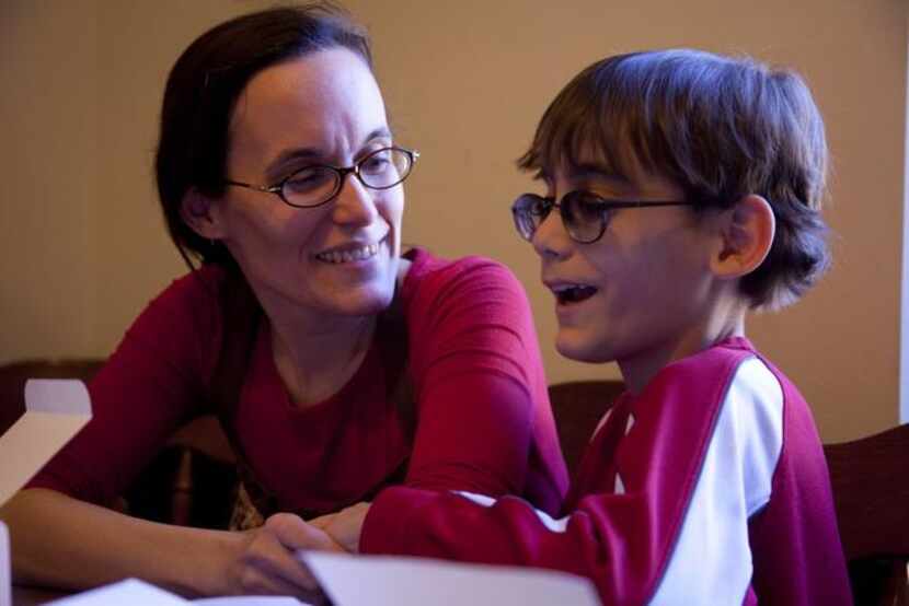 Ben Pierce,  9, and his mother, Heidi Thaden-Pierce, sold truffles to help raise money for a...
