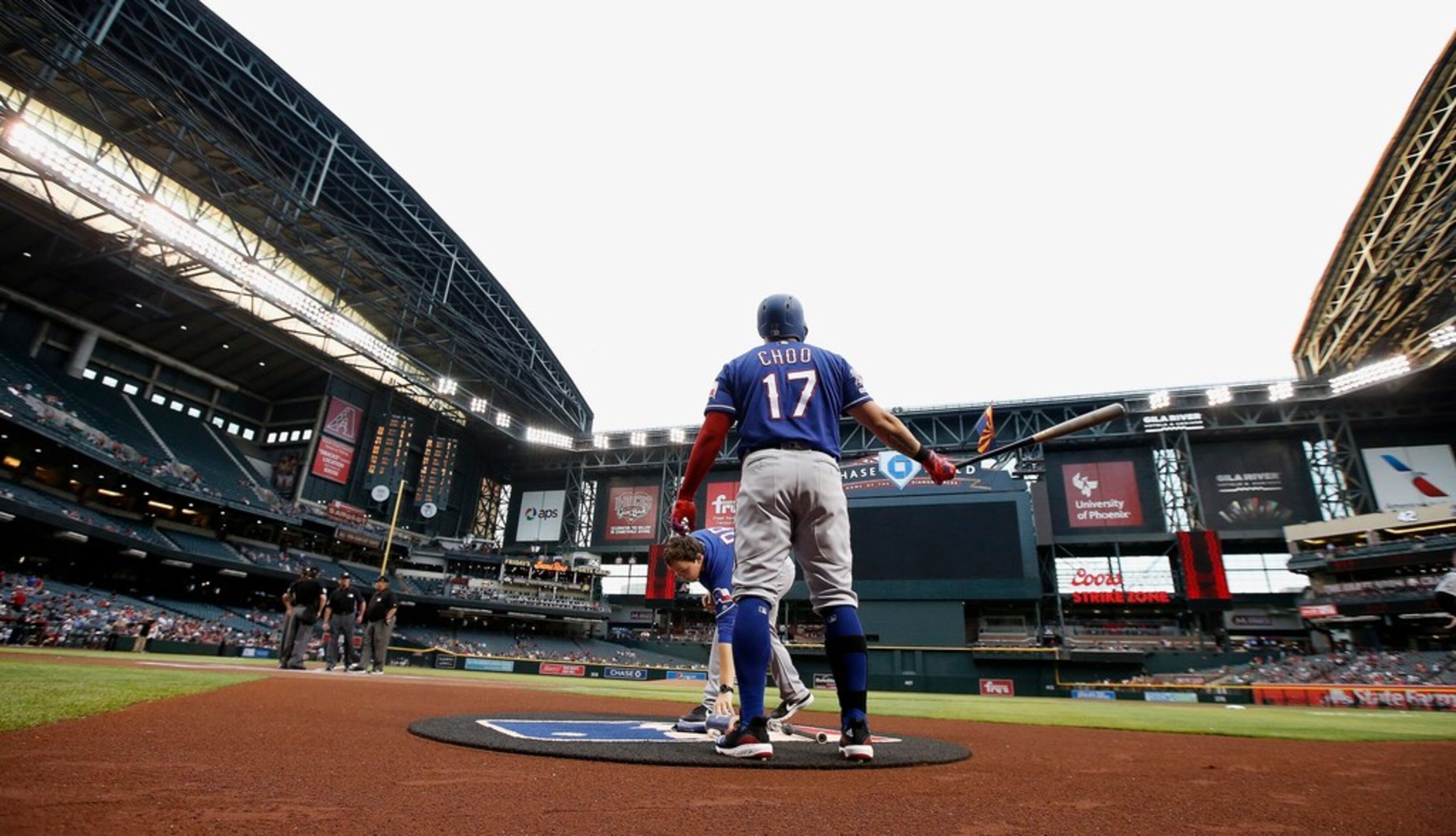 Texas Rangers' Shin-Soo Choo, of South Korea, waits to bat in the first inning of the team's...