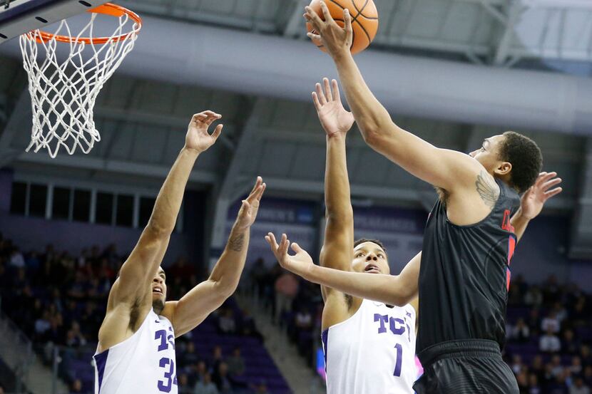 Southern Methodist Mustangs forward Ethan Chargois (5) attempts a shot in front of TCU...