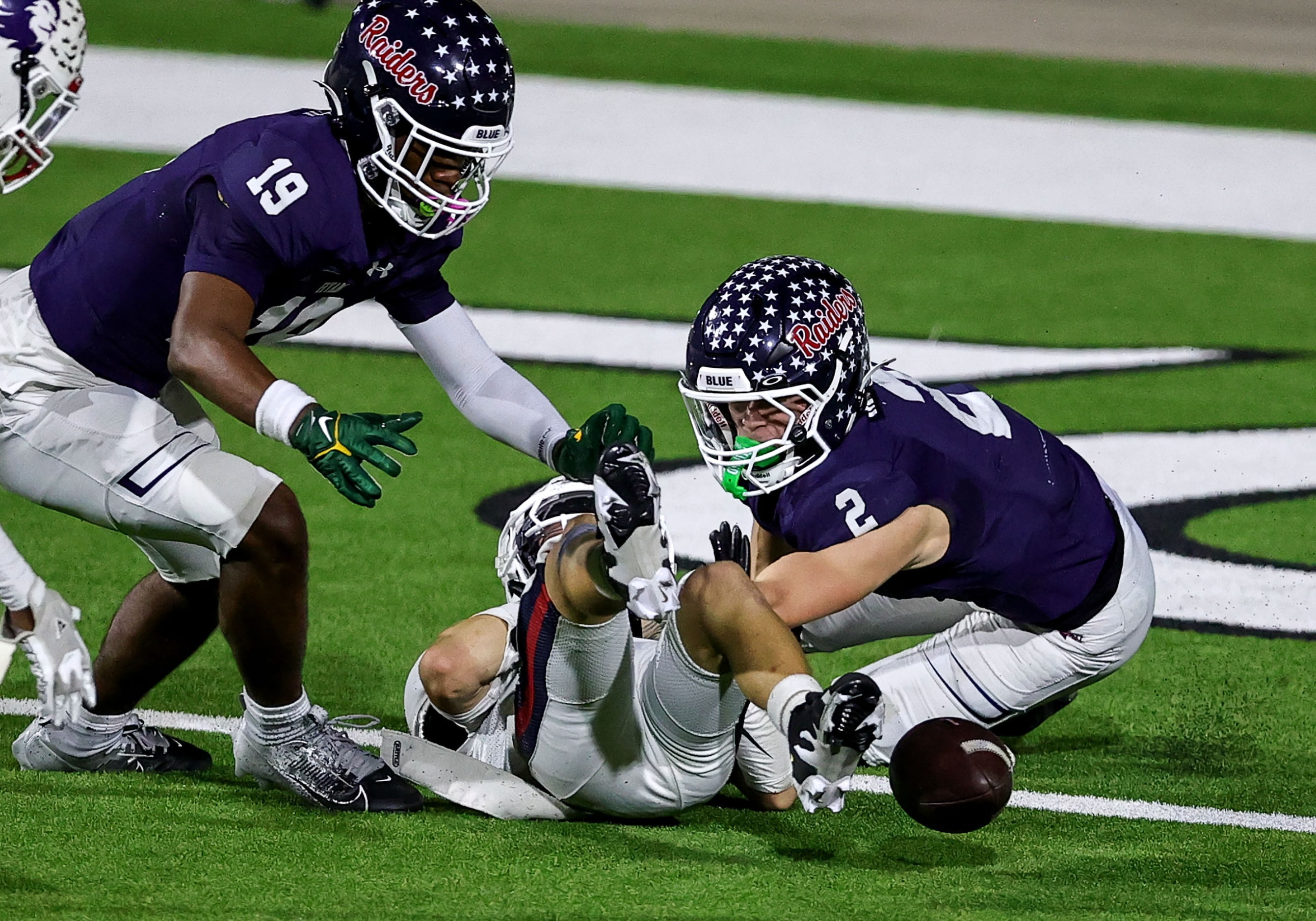 Denton Ryan wide receiver Braeden Mussett (2) tries to recover a fumble against Richland...