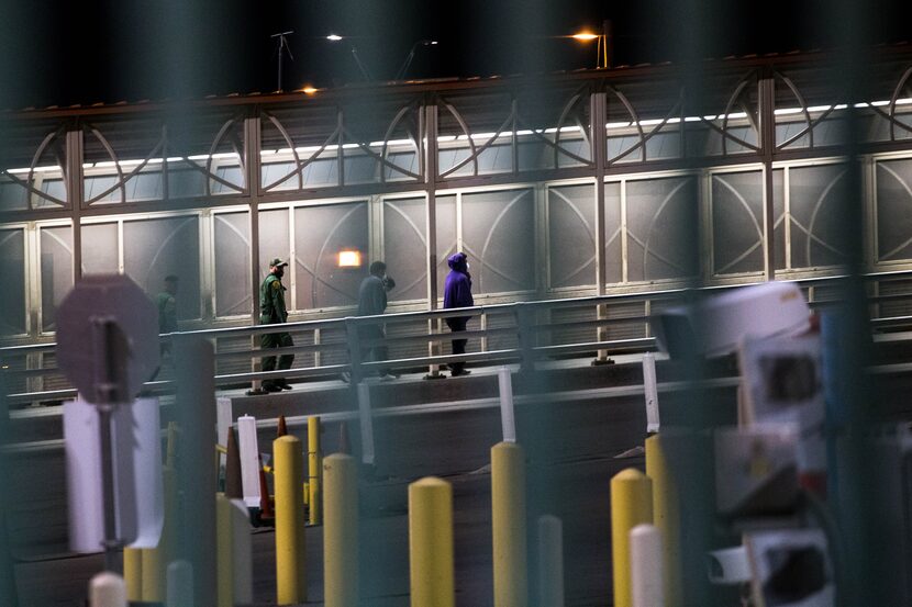 U.S. Border Patrol agents escort travelers back to Ciudad Juarez, Mexico, after rejecting...