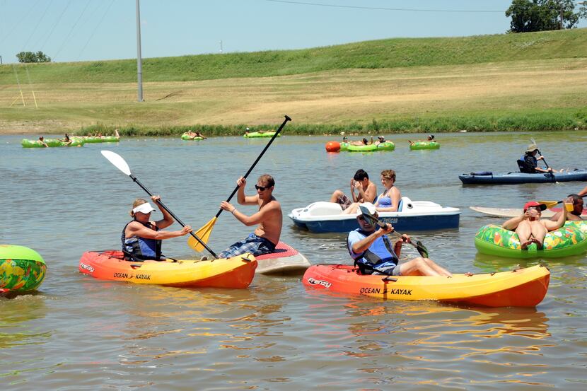 Canoers paddle on the Trinity River at Sunday Funday at Panther Island Pavilion in Fort...