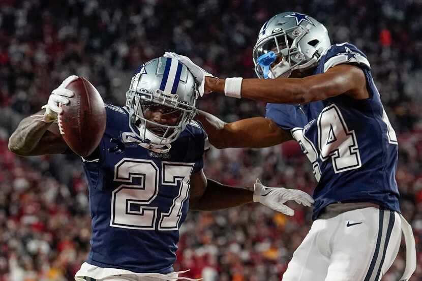 Dallas Cowboys safety Jayron Kearse (27) celebrates with safety Israel Mukuamu after...