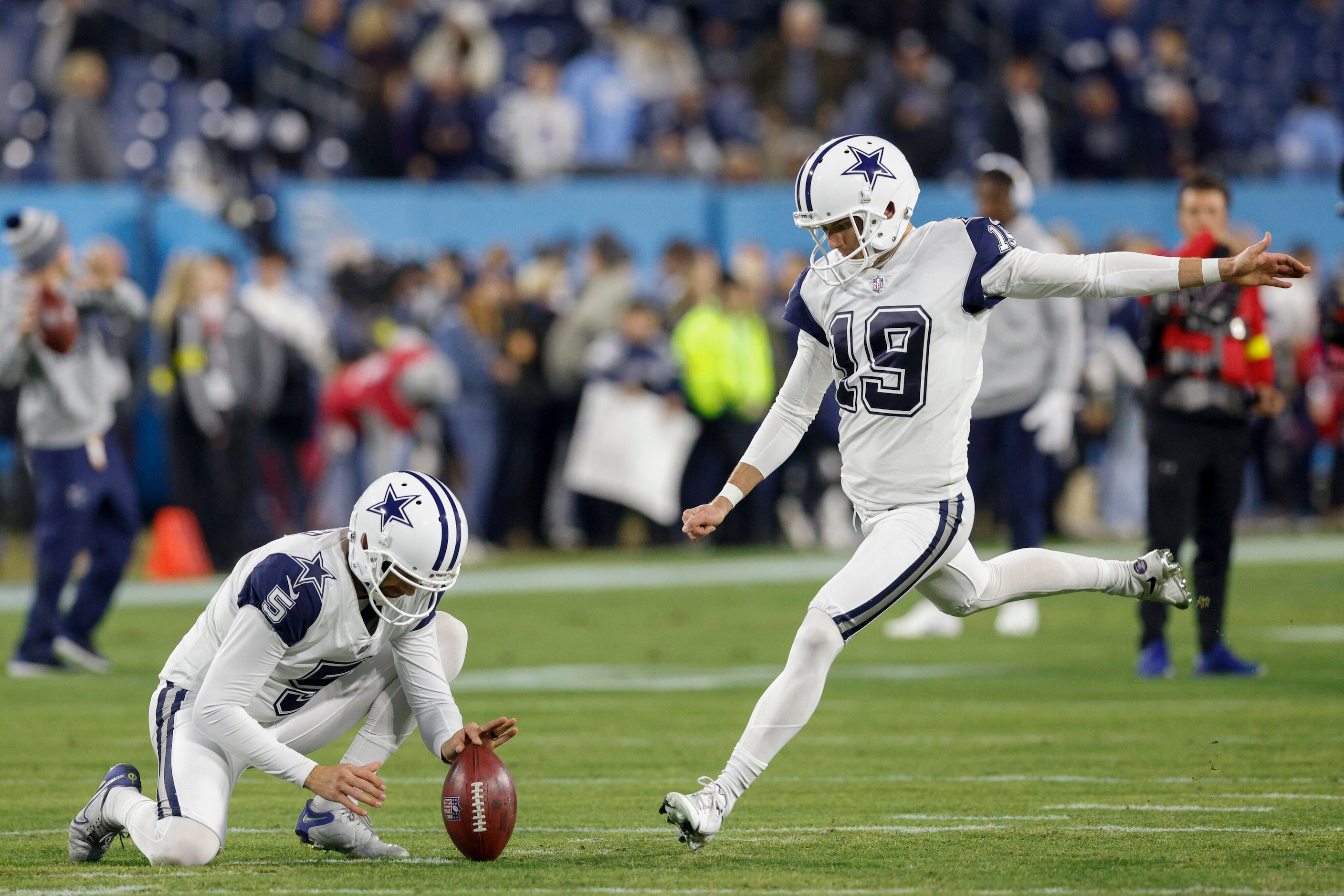 Dallas Cowboys punter Bryan Anger (5) and place kicker Brett Maher (19) warm up wearing the...