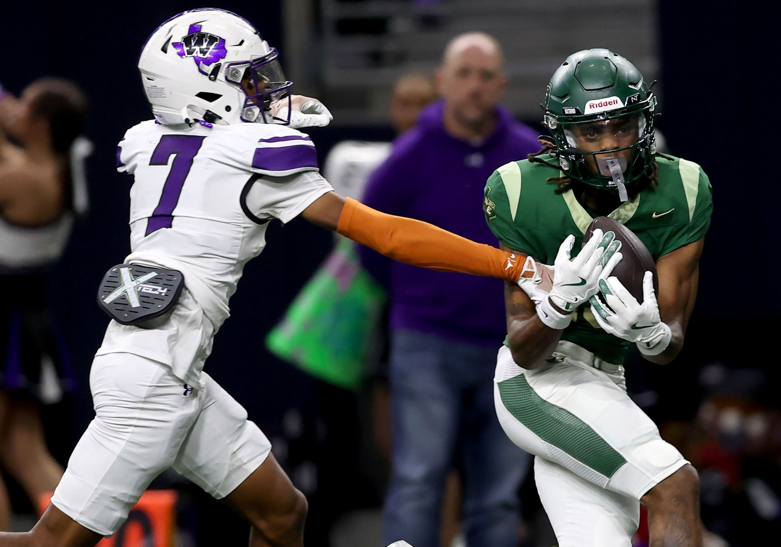 DeSoto wide receiver Daylon Singleton (right) comes up wth a touchdown reception against...