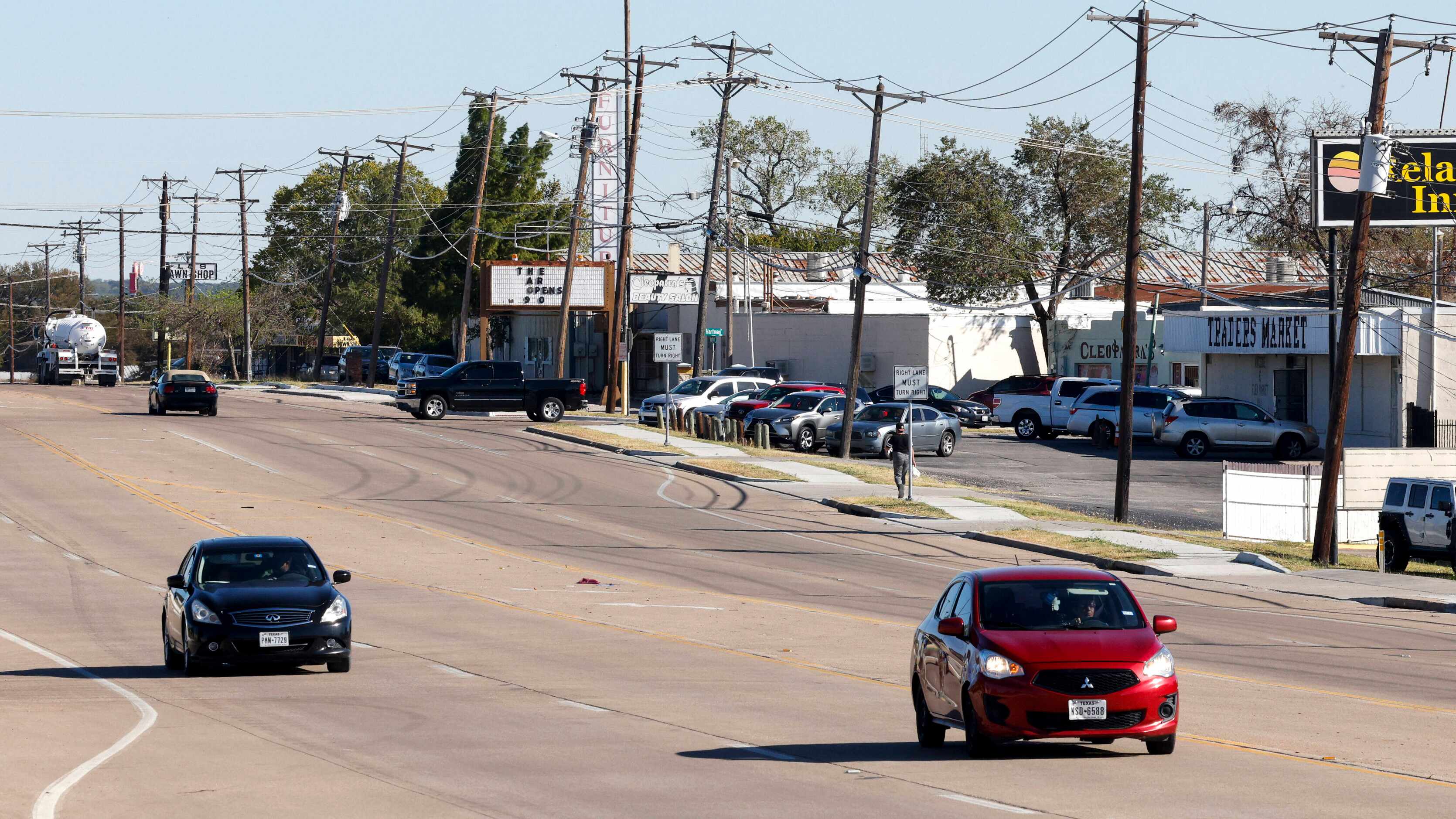 Motorists drive along Mansfield Highway in Forest Hill, Texas, Wednesday, Oct. 26, 2022.