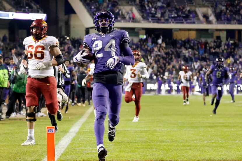 TCU Horned Frogs cornerback Josh Newton (24) crosses the goal line for a touchdown after...