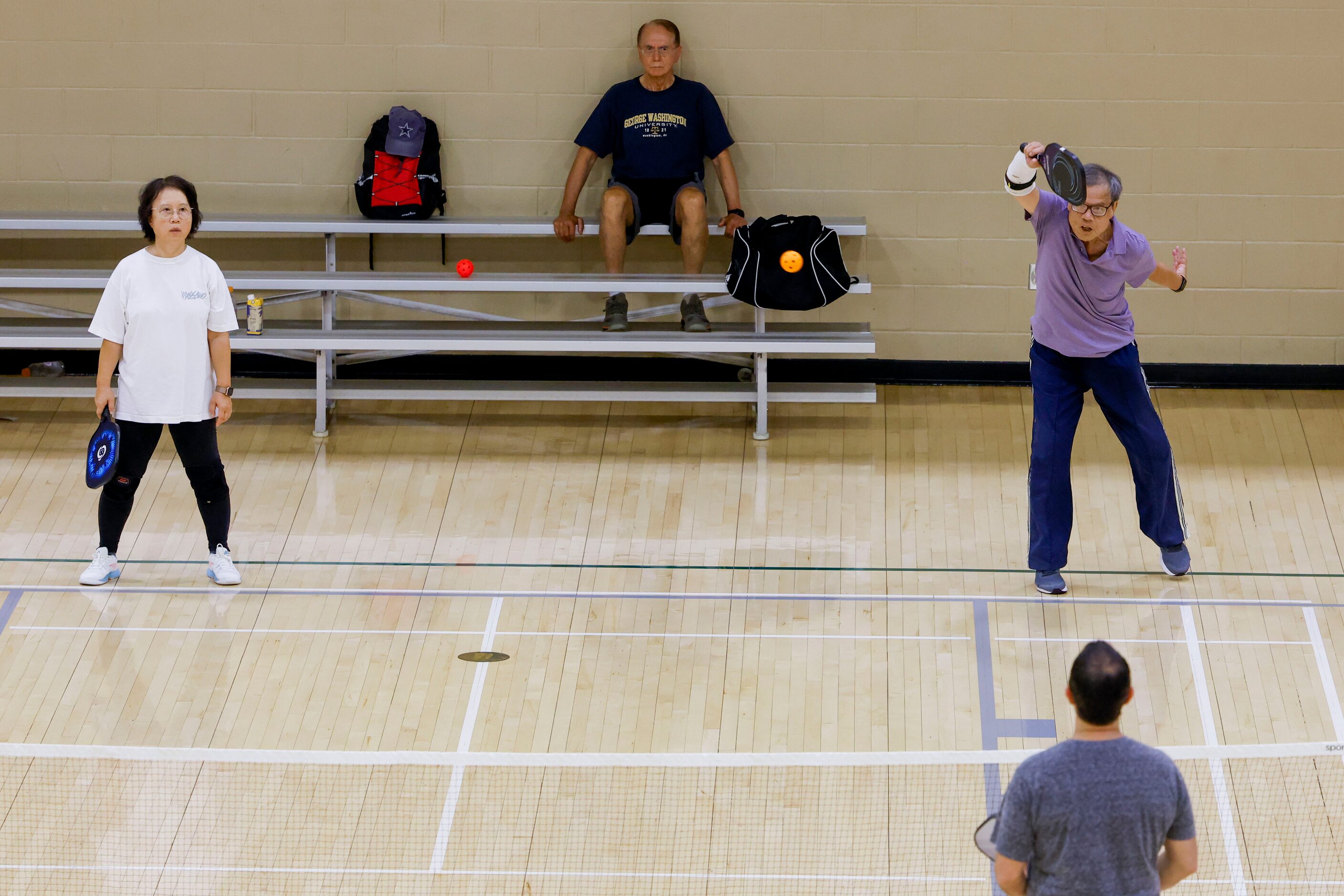 Yawen Tiegerman (left) of Frisco watches as her teammate Tet Wu (right) of Plano hits during...