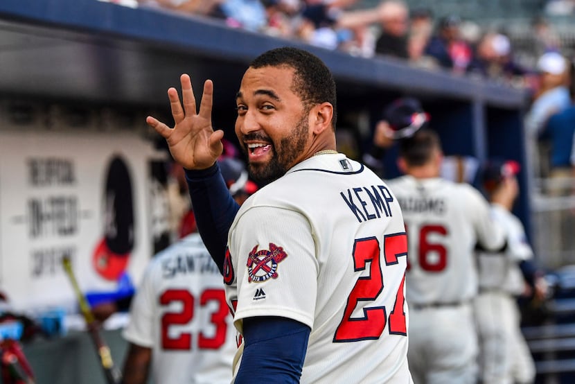 Atlanta Braves' Matt Kemp waves to a fan after the team's baseball game against the...