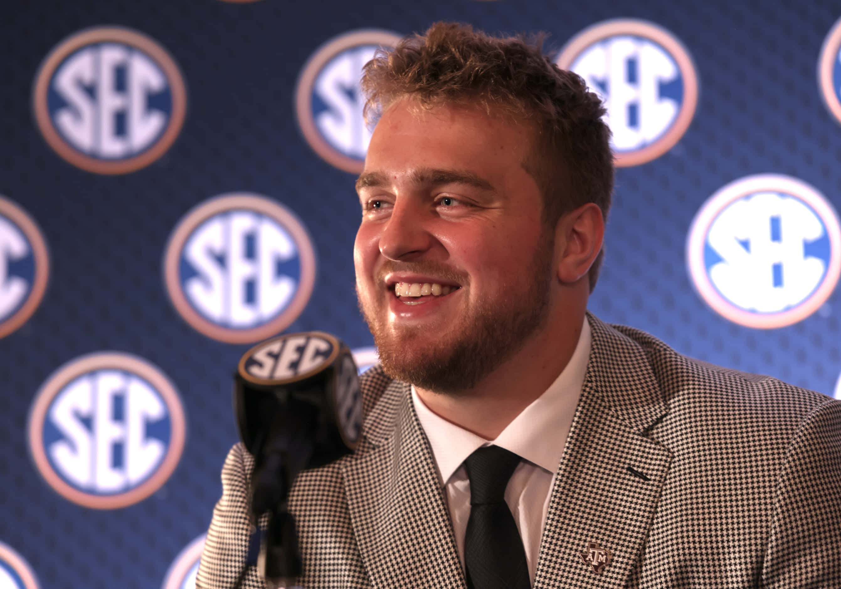 Texas A&M offensive lineman Trey Zuhn lll shares a light moment with members of the media...