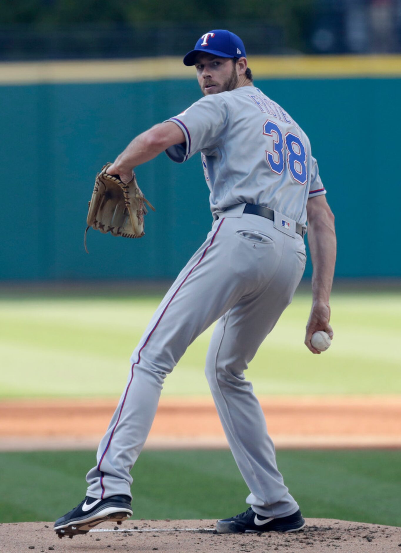 Texas Rangers starting pitcher Doug Fister delivers in the first inning of a baseball game...