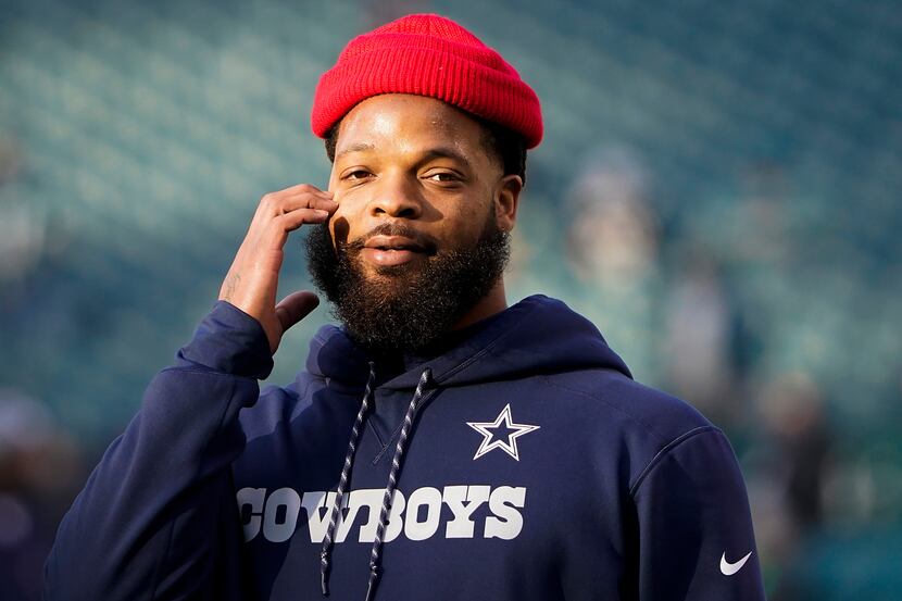 Dallas Cowboys defensive end Michael Bennett warms up before an NFL football game against...