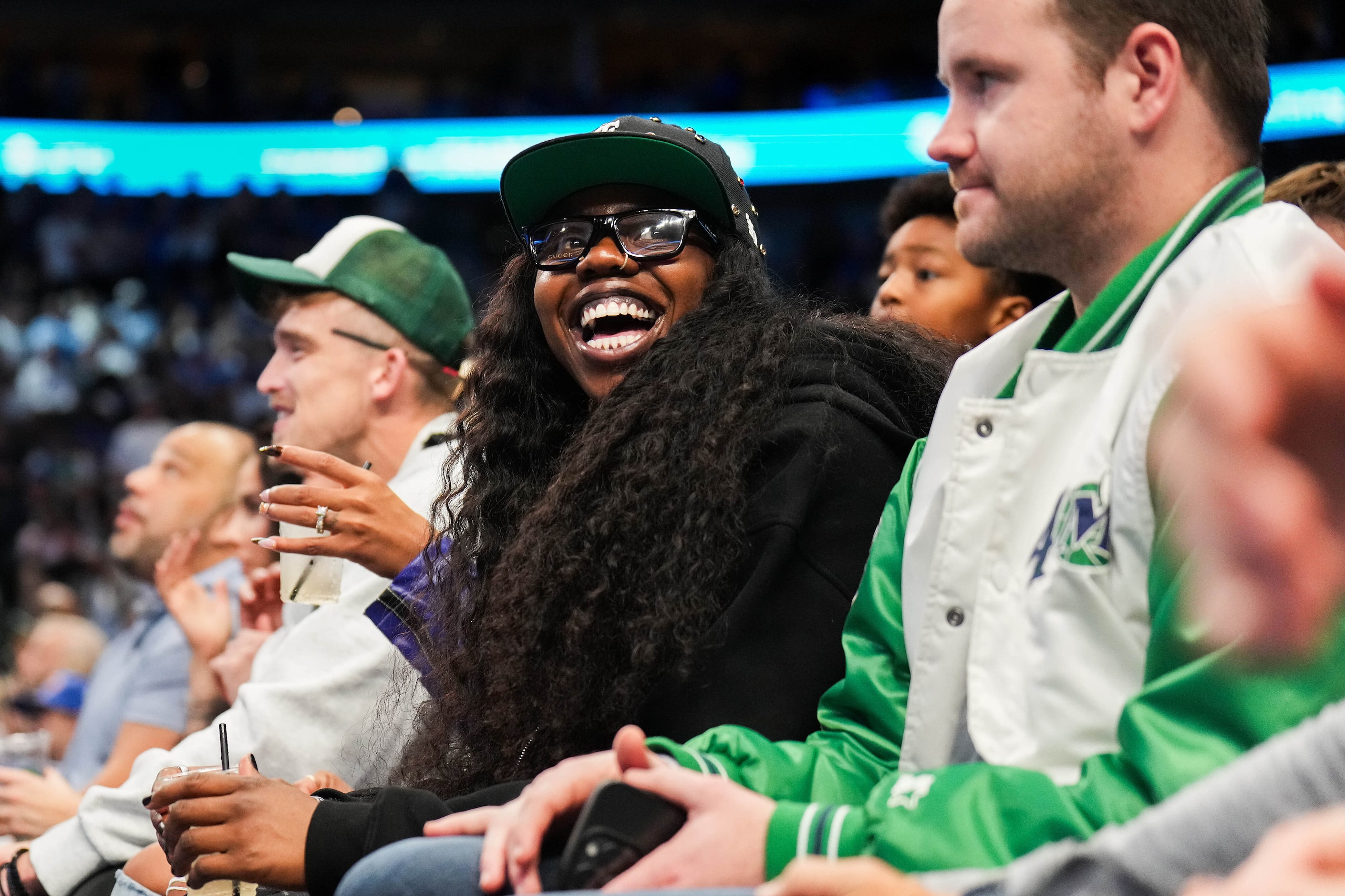 Dallas Wings guard Arike Ogunbowale watches during the second half of an NBA basketball game...