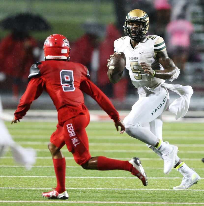 DeSoto's Tristen Wallace (5) looks to pas as Cedar Hill's Dylain Baxter (9) looks to make a...