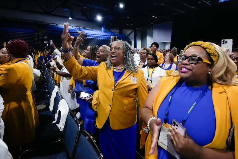 Audience members react as Vice President Kamala Harris delivers remarks at a Sigma Gamma Rho...