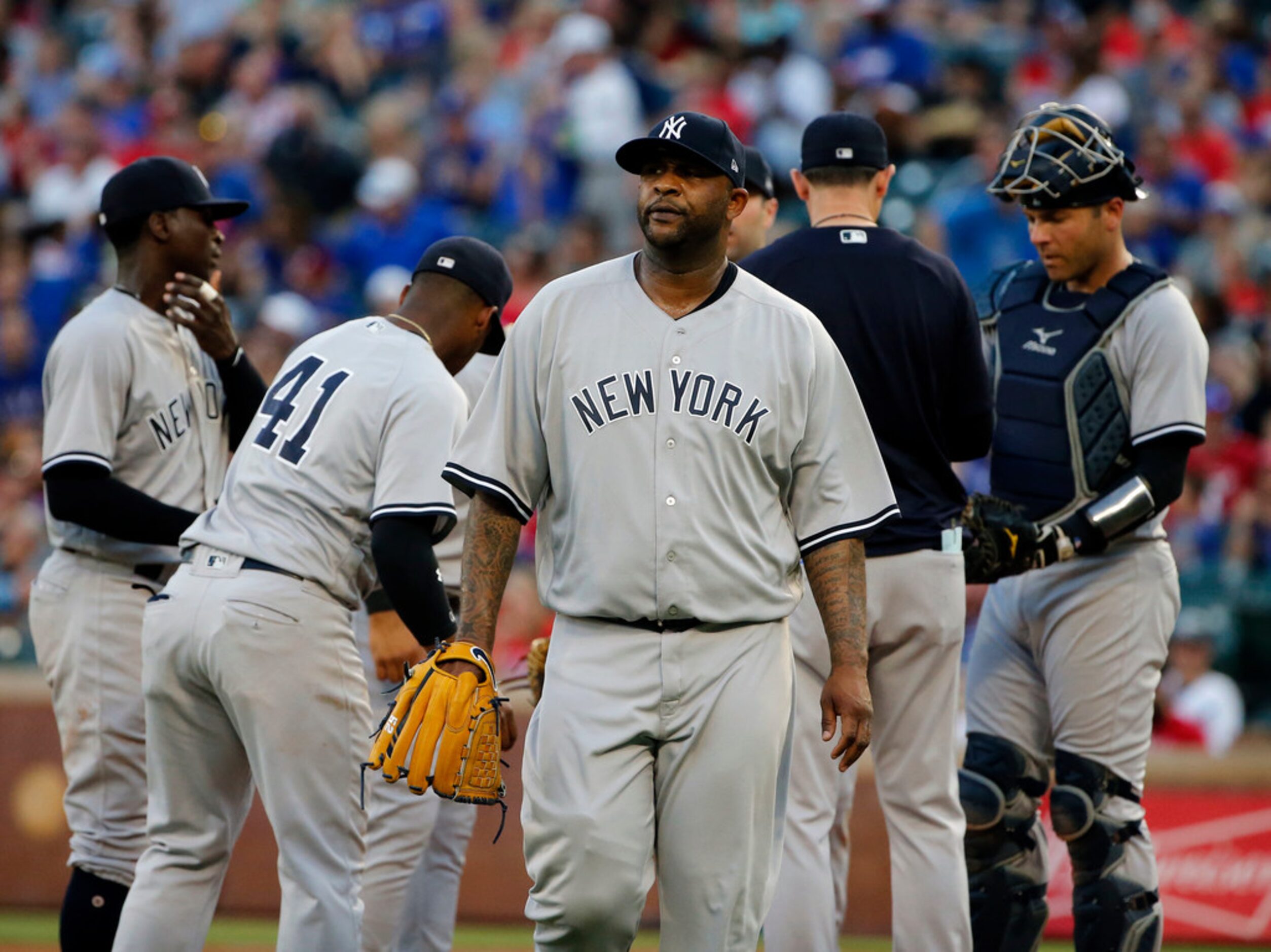 New York Yankees starting pitcher CC Sabathia is pulled from the baseball game during the...