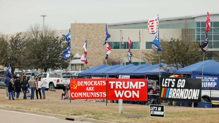 Supporters of former President Donald Trump protested outside the VA Clinic on Tuesday...