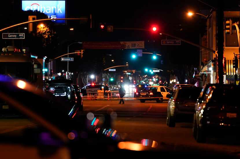 Police investigated a scene where a shooting took place in Monterey Park, Calif., Sunday,...
