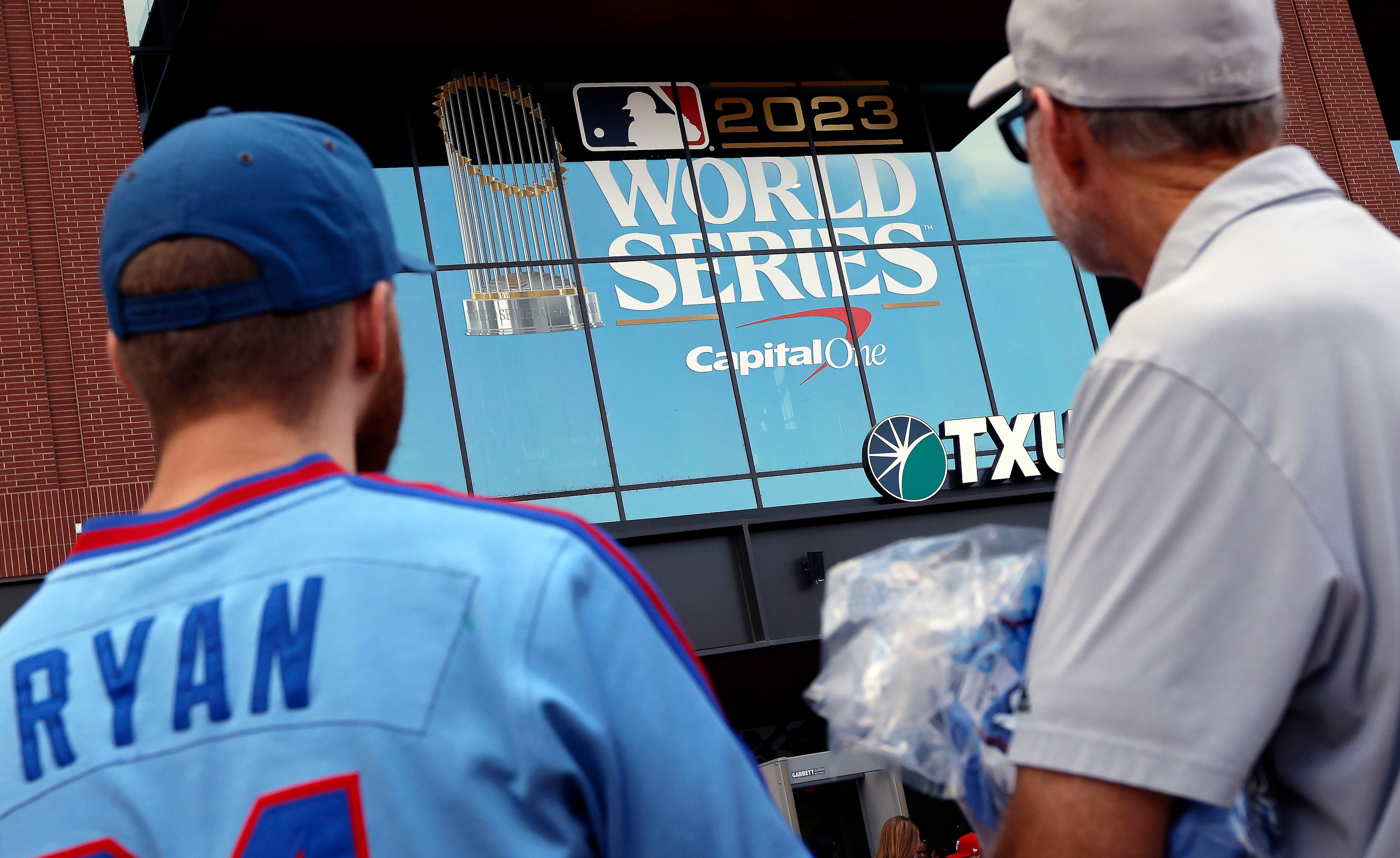 Texas Rangers fans file into Globe Life Field in Arlington before Game 1 of the World Series...