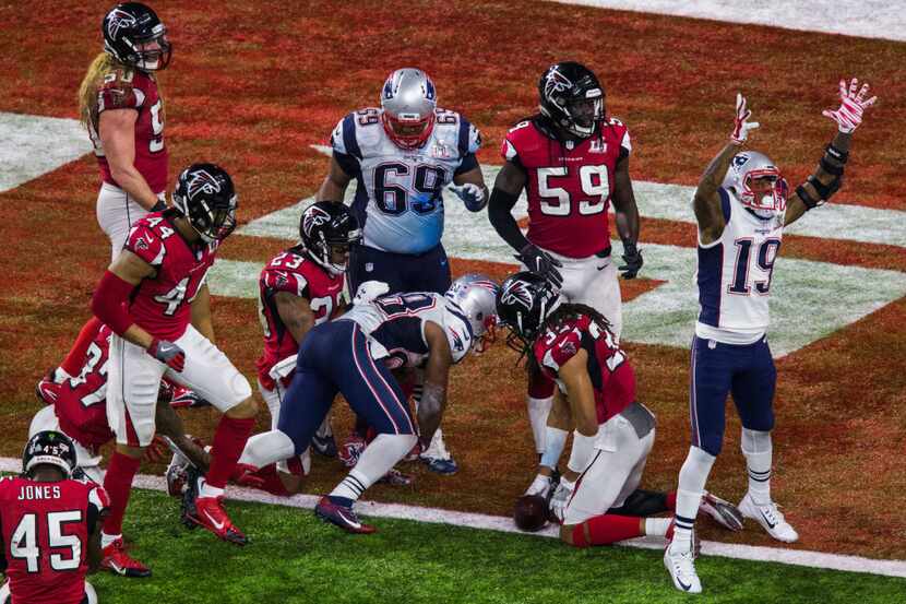 New England Patriots running back James White (28) runs to the end zone for a touchdown to...
