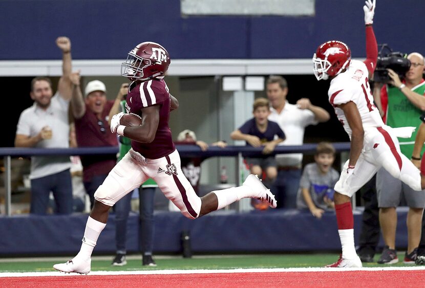 ARLINGTON, TX - SEPTEMBER 29:  Jashaun Corbin #7 of the Texas A&M Aggies runs the ball past...