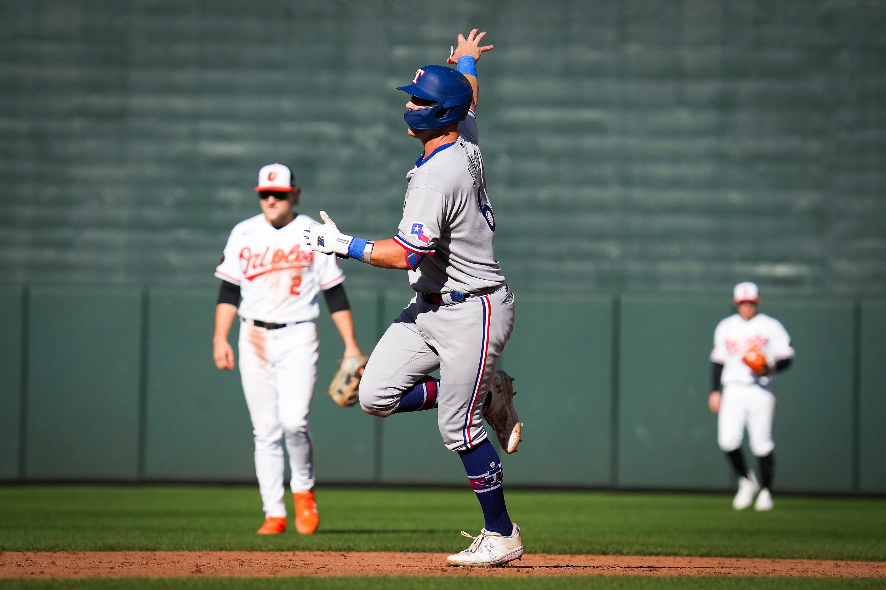 Texas Rangers third baseman Josh Jung round the bases after hitting a solo home run during...