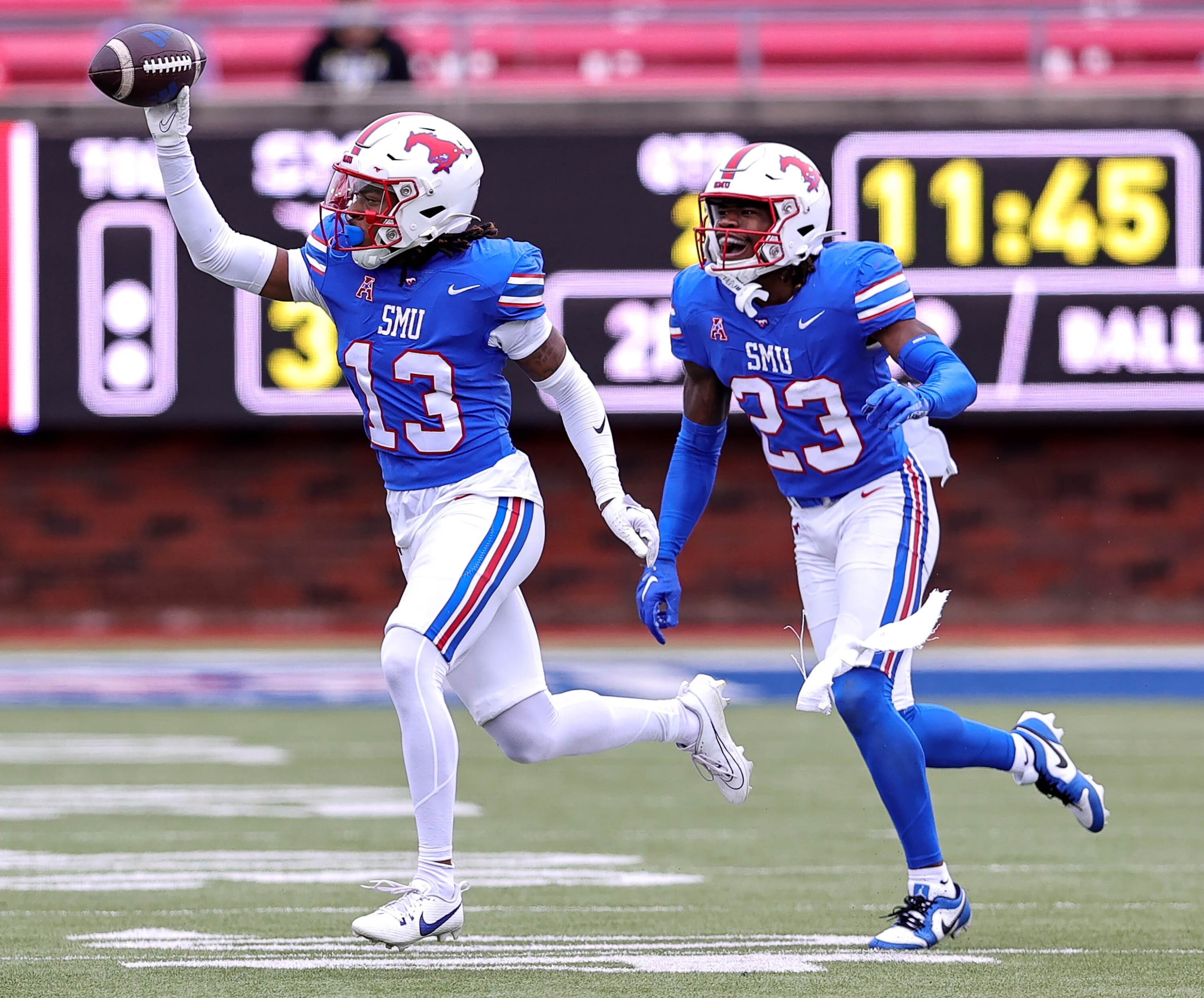 SMU cornerbacker Jaelyn Davis-Robinson (13) celebrates with safety Isaiah Nwokobia (23)...